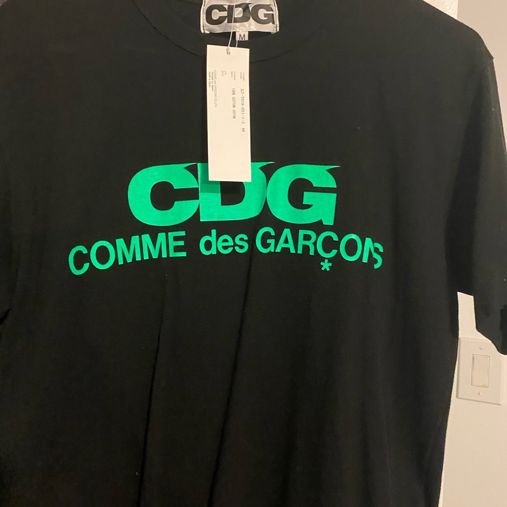 New CDG size M